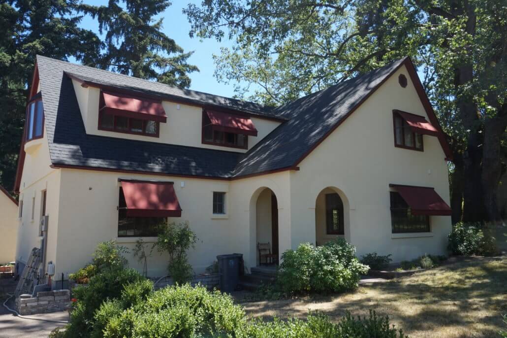 A retractable window awning provides shade and blocks incoming solar heat.